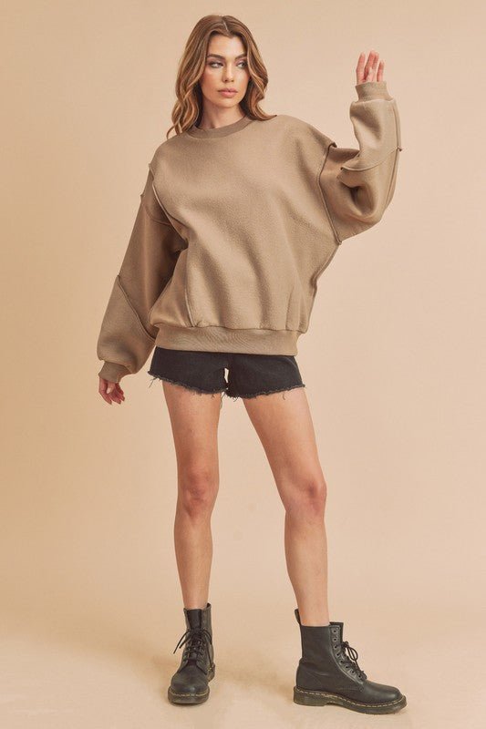 Aemi + Co Exposed Seam Round Neck Drop Shoulder Sweatshirt - S. M. & Co.