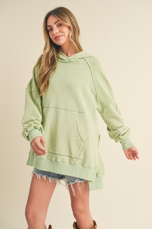 Aemi + Co Exposed Seam Side Slit Hoodie with Kangaroo Pocket - S. M. & Co.