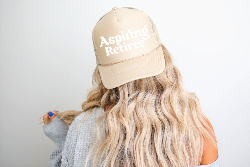 Aspire To Retire DTF Printed Khaki Trucker Hat White writing - S. M. & Co.