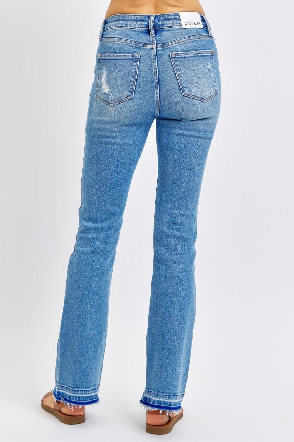 Judy Blue Full Size Mid Rise Destroyed Hem Distressed Jeans - S. M. & Co.